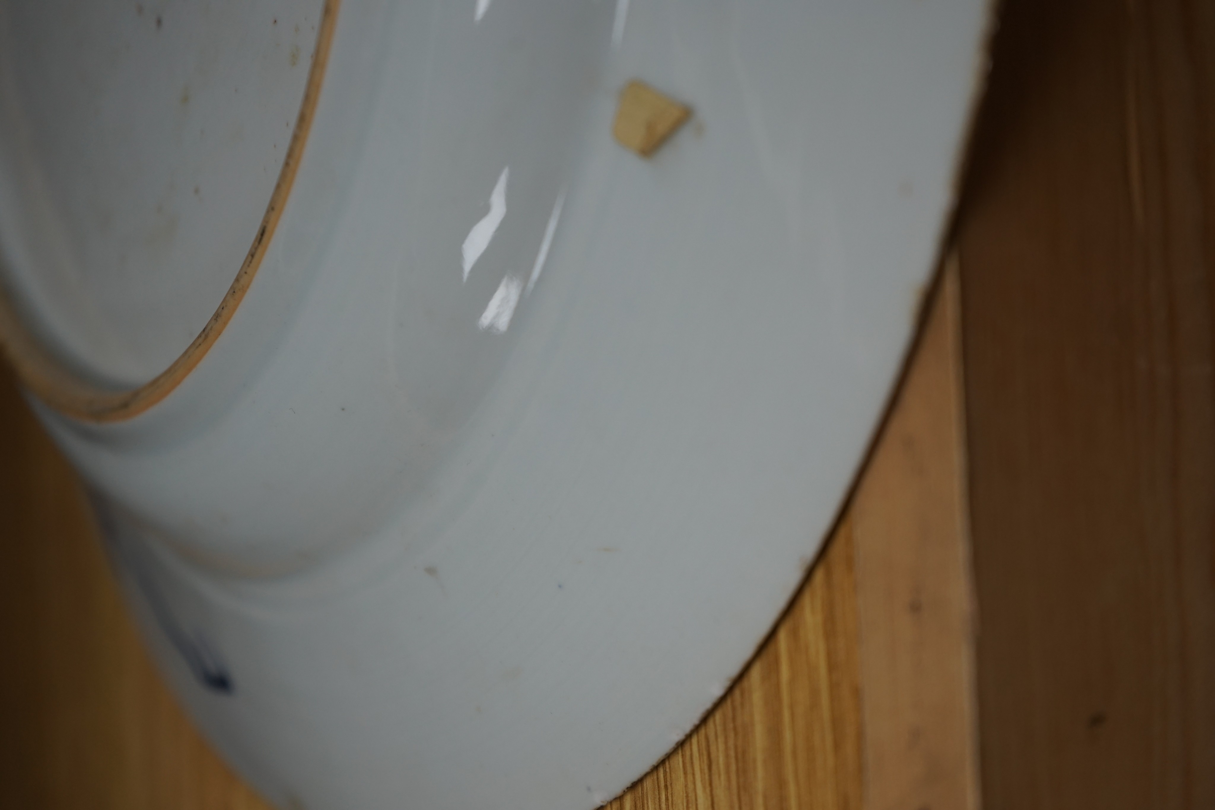 An 18th century Chinese blue and white circular dish decorated with flowering plants, Dia 32.5cm